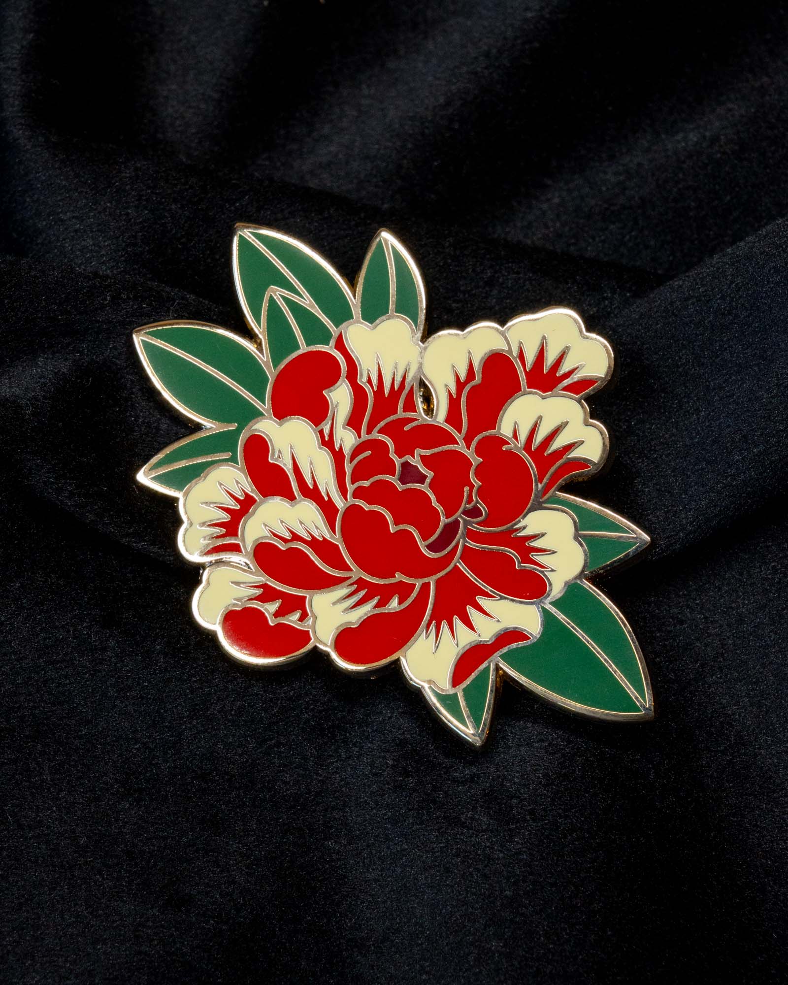 Peony enamel pin from the Immovable collection by Geoffrey Wong, featuring a red and ivory Japanese tattoo-inspired flower symbolizing prosperity and courage.