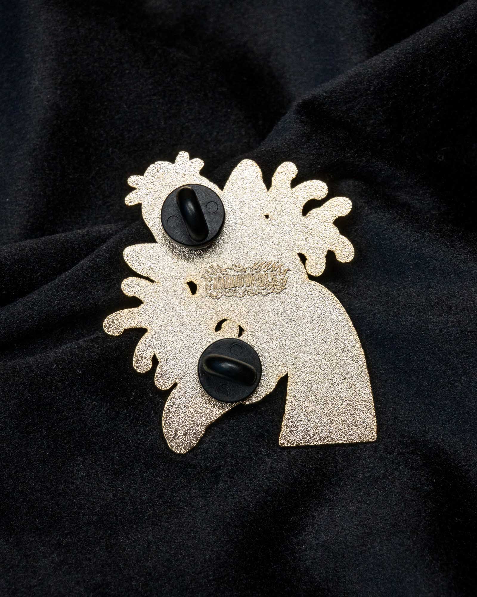 Koi enamel pin from the Immovable collection by Geoffrey Wong, showing a vibrant koi swimming upward through waves as a symbol of perseverance and transformation.