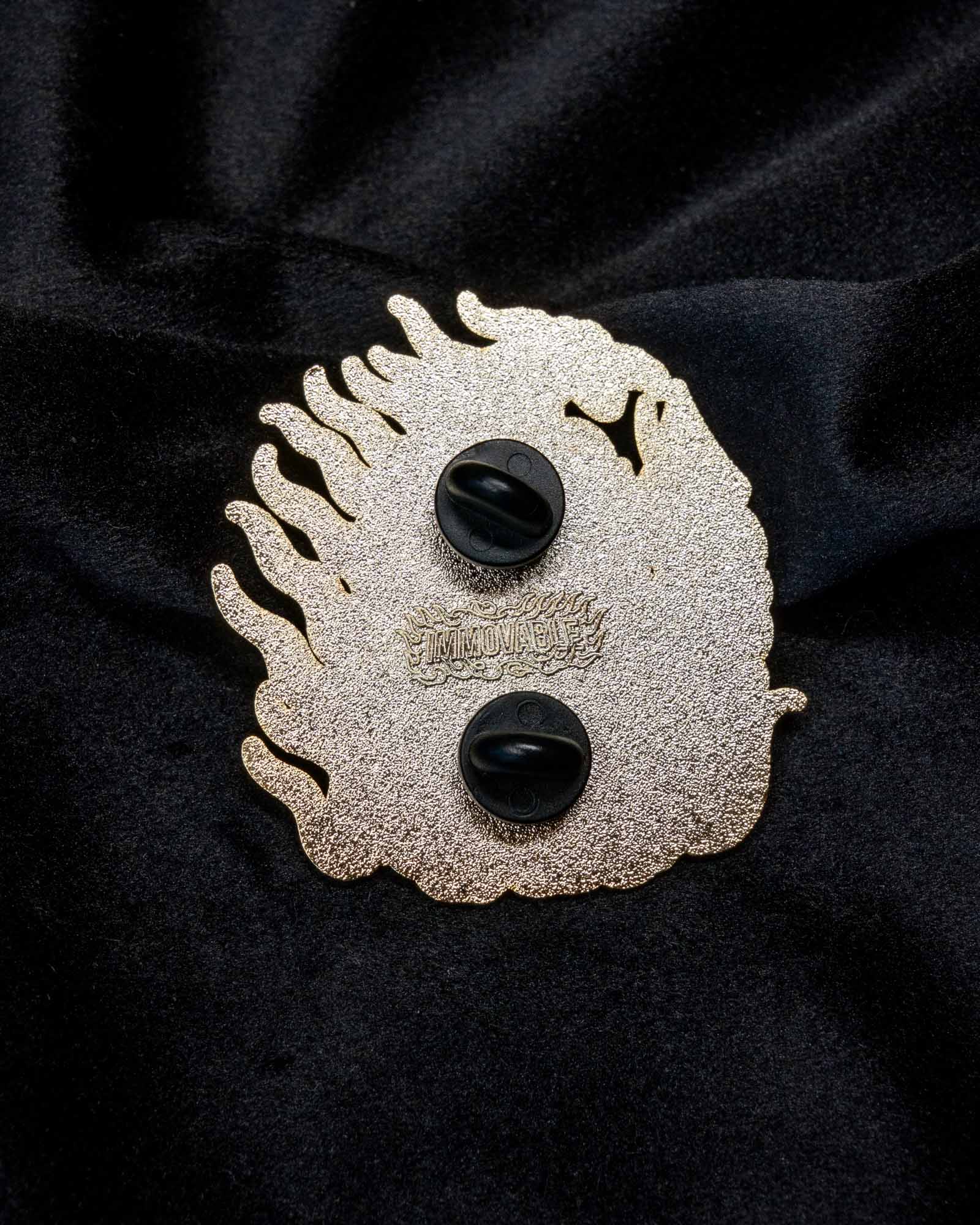 Fudō Myōō enamel pin from the Immovable collection by Geoffrey Wong, featuring a Japanese tattoo-inspired protector deity surrounded by flames.