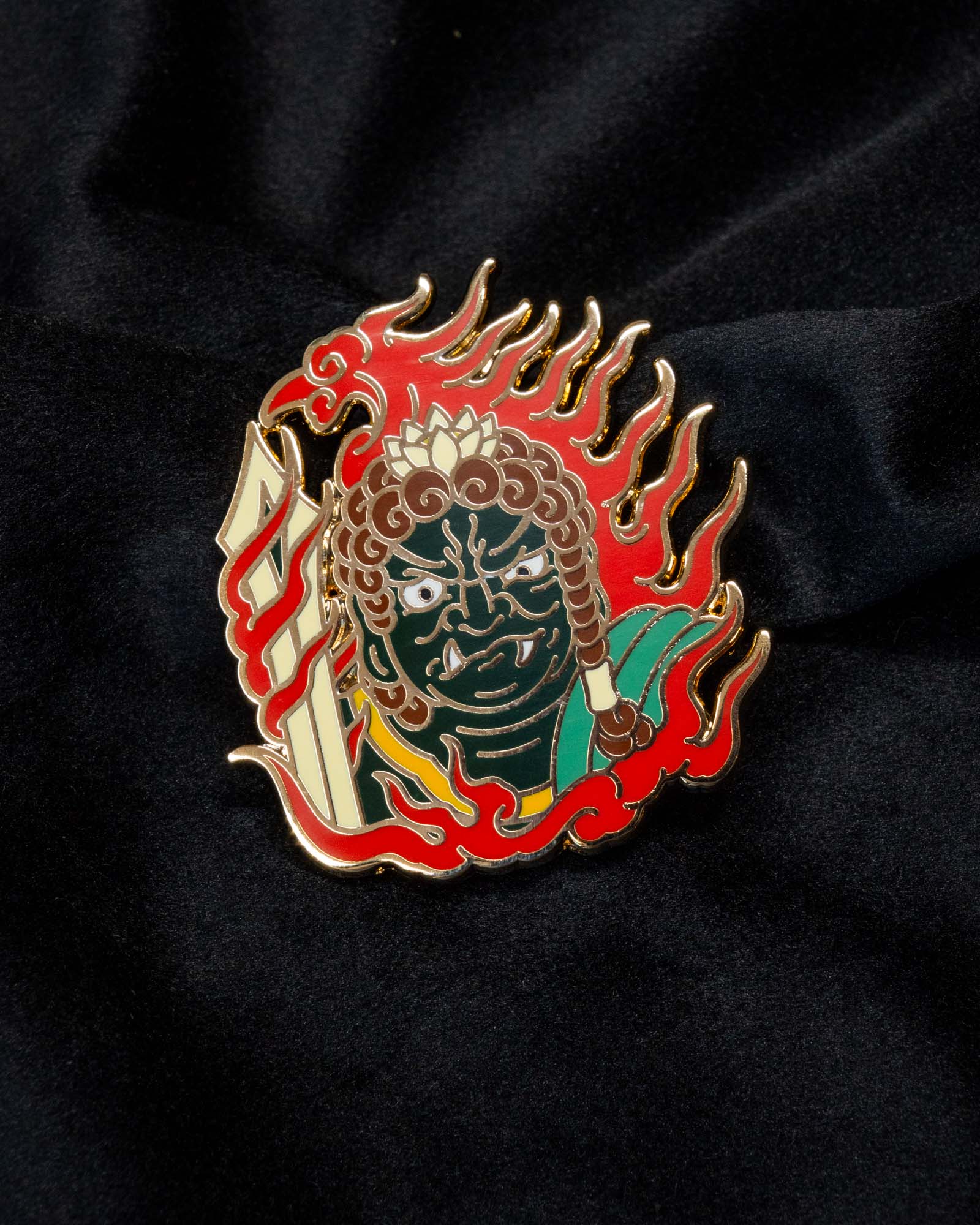 Fudō Myōō enamel pin from the Immovable collection by Geoffrey Wong, featuring a Japanese tattoo-inspired protector deity surrounded by flames.