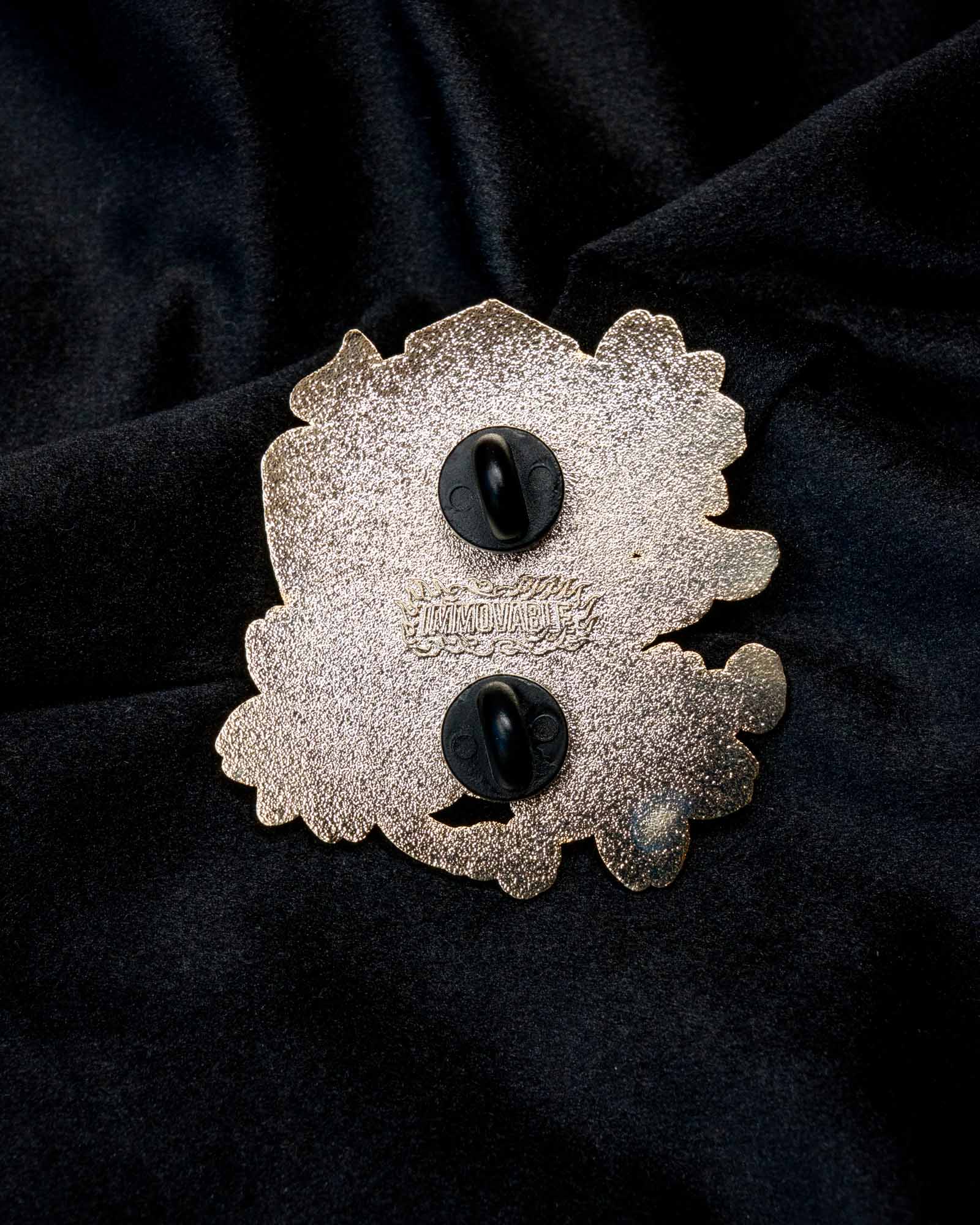 Tengu enamel pin from the Immovable collection by Geoffrey Wong, featuring a red mountain spirit mask that embodies protection, pride, and discipline.