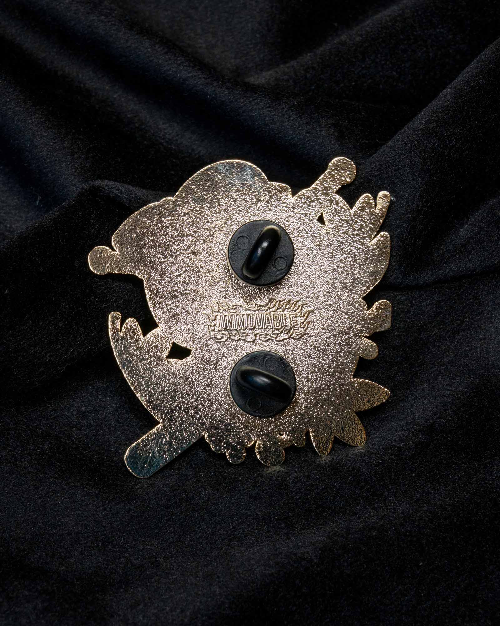 Namakubi enamel pin from the Immovable collection by Geoffrey Wong, depicting a traditional Japanese severed head motif that represents courage, honor, and impermanence.