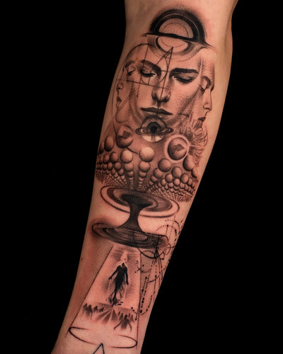 Black and grey realism tattoo with surreal female portraits, cosmic planets, and abstract space elements on the forearm