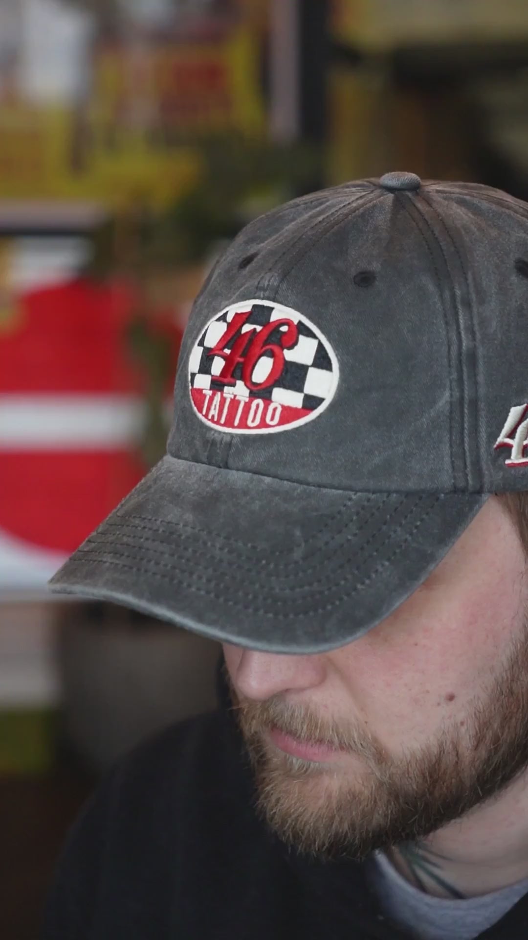 Video of a man wearing a cap with "46 tattoo" logo